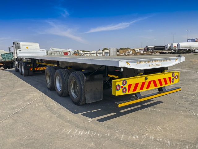 Used 2012 Henred Fruehauf Flatdeck Tri-Axle Trailer For Sale